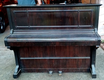 A full view of the piano - the music stand is tucked away inside the top lid.